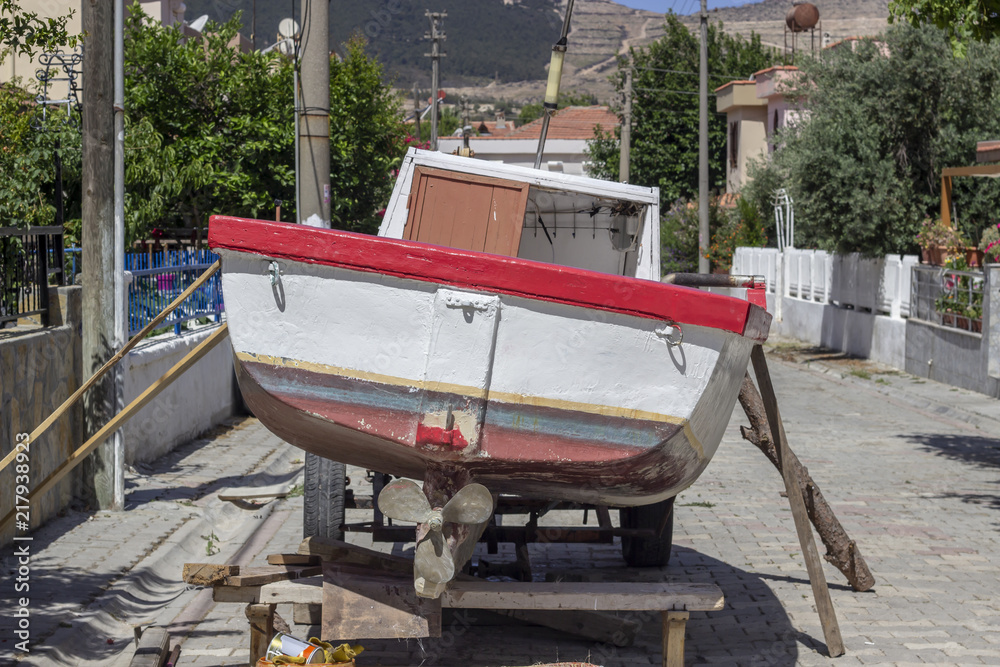 Back shot of maintenance for wooden fishing boat Back shot of maintenance for wooden fishing boat