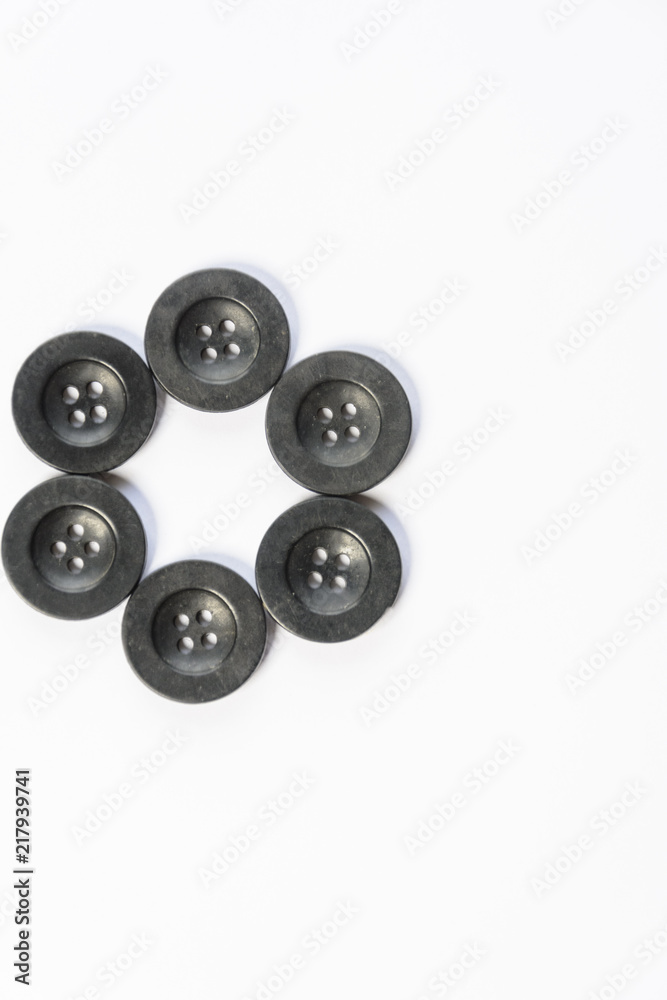 black buttons for sewing on a white background black buttons for sewing on a white background
