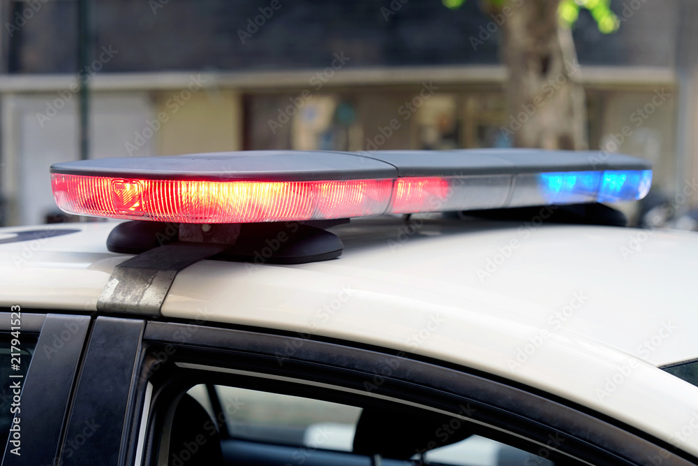 Fototapeta premium Close-up of the blue and red lights on top of a police vehicle.