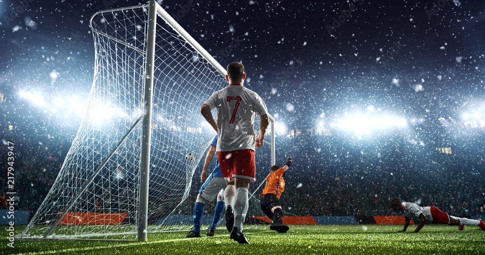 Fototapeta premium Intense soccer moment in front of the goal on the professional soccer stadium.