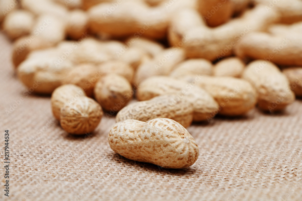 Peanuts in shells on the background of sack cloth. Peanuts in shells on the background of sack cloth.
