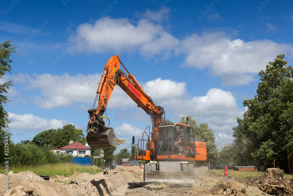 excavator work on construction site, street reconstruction excavator work on construction site, street reconstruction