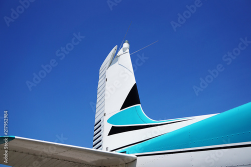 Tail of an Airplane against the Blue Sky