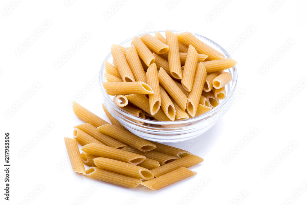 Container with wholemeal pasta isolated on a white background Container with wholemeal pasta isolated on a white background
