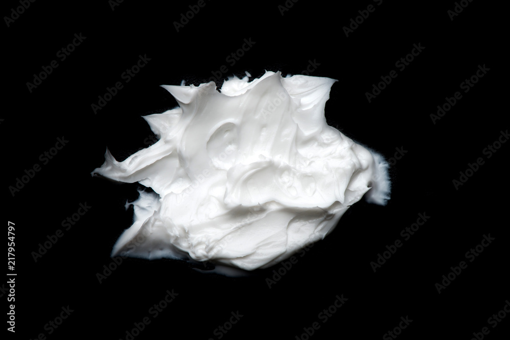 white cream on a black background