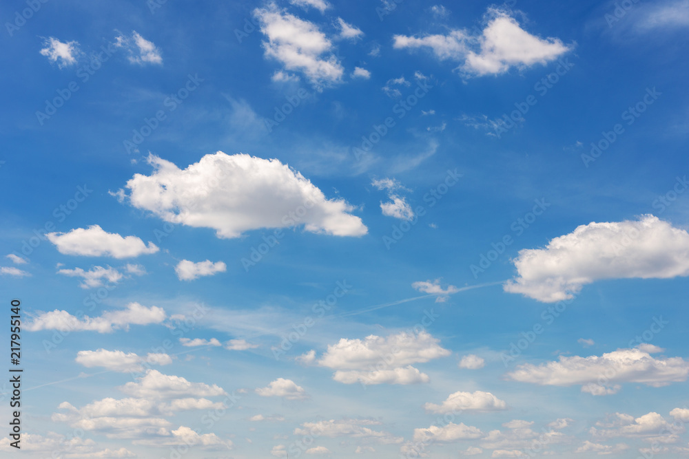 Fototapeta premium Vibrant blue sky with white clouds. Beautiful nature background