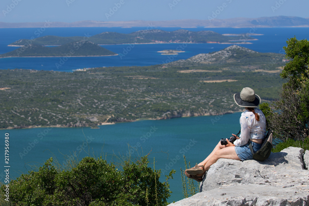 the woman admires the beautiful view of Croatia from the hills,Vransko jezero Croatia