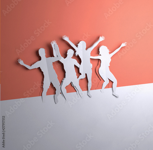 Folded Paper art origami.A group of active people jumping. Paper craft 3D illustration.