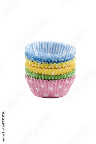 Paper cupcake holders on white background