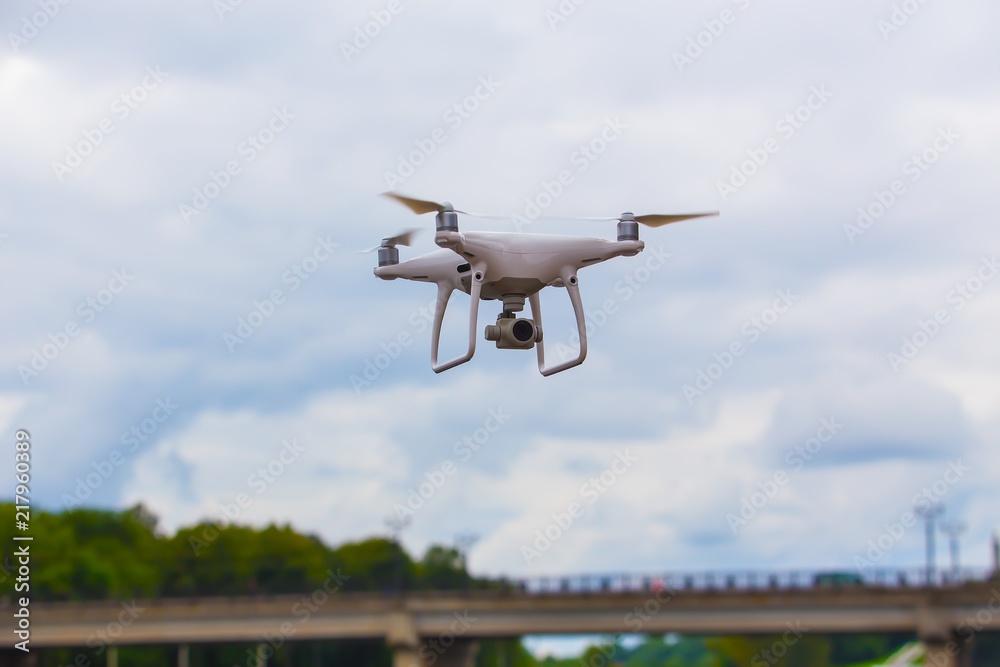 drone with a video camera flies in the sky drone with a video camera flies in the sky