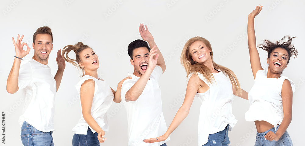 Obraz premium Group of smiling people jumping,having fun together.