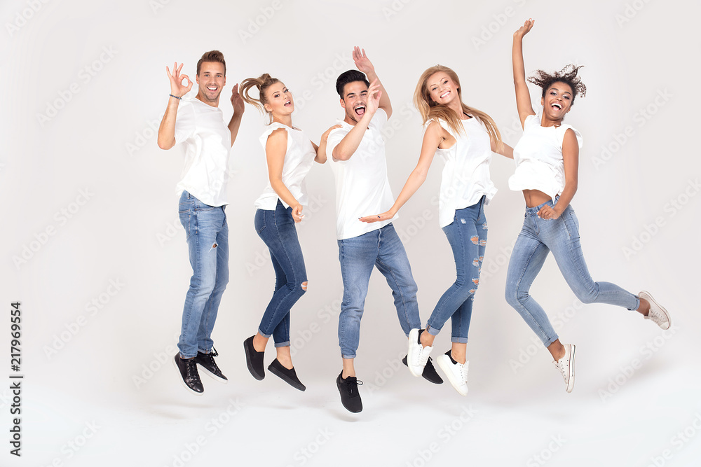 Obraz premium Group of smiling people jumping,having fun together.