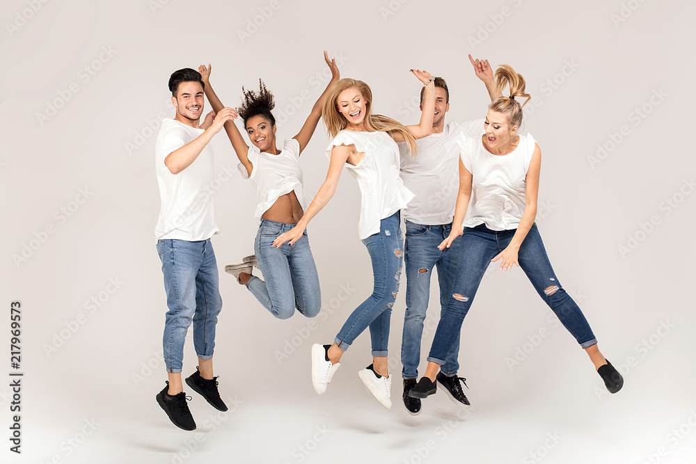 Group of smiling people jumping,having fun together. Group of smiling people jumping,having fun together.