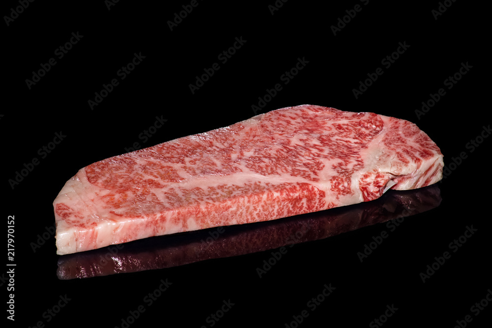 japanese Saga raw beef steak isolated on the black mirror