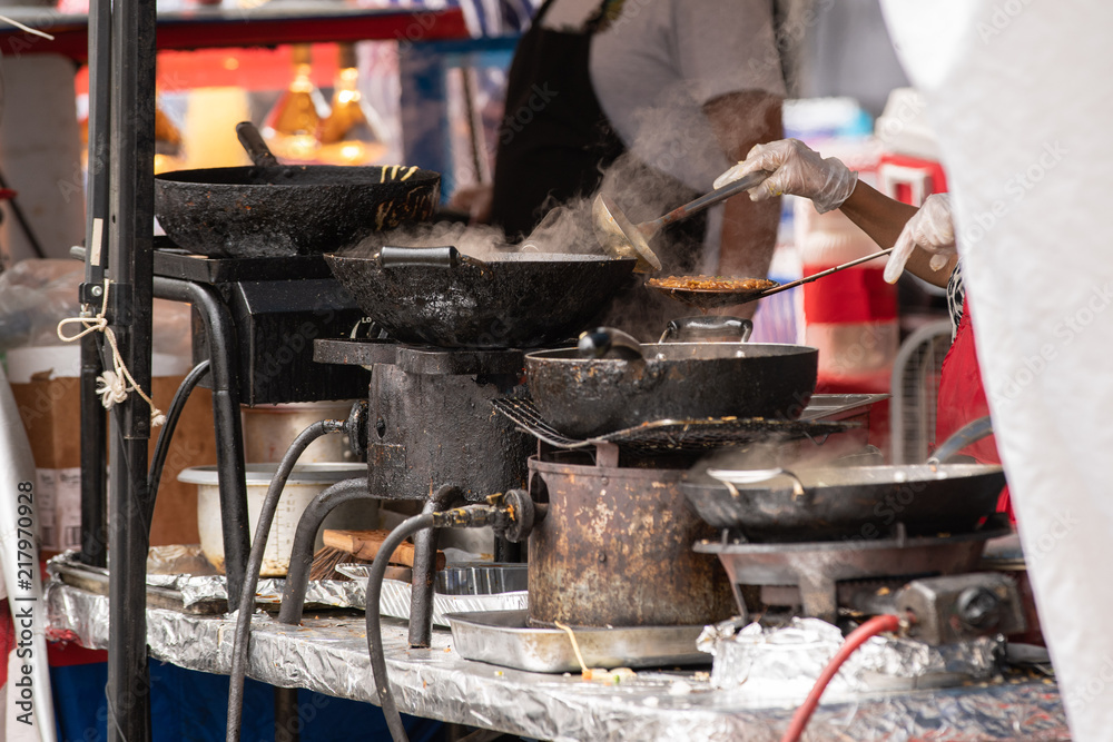 Oriental chicken food made to order at outdoor festival. Oriental chicken food made to order at outdoor festival.
