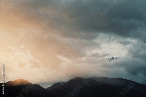 mount kinabalu in the sunset peaking across the clouds at Sabah, Borneo, Malaysia