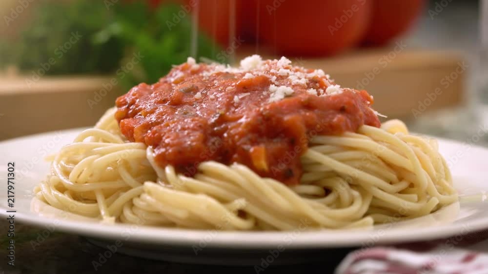 Italian spaghetti dinner with marinara / tomato sauce, parmesan cheese, and fresh vegetables. Italian spaghetti dinner with marinara / tomato sauce, parmesan cheese, and fresh vegetables.