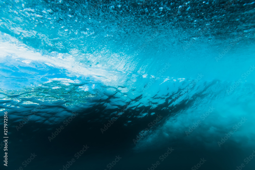 Breaking barrel wave is underwater. Ocean in underwater