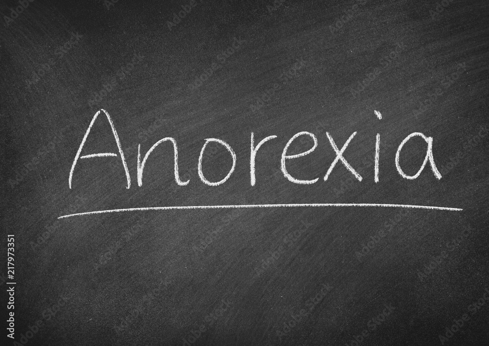 Fototapeta premium Anorexia concept word on a blackboard background