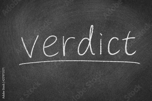 verdict concept word on a blackboard background