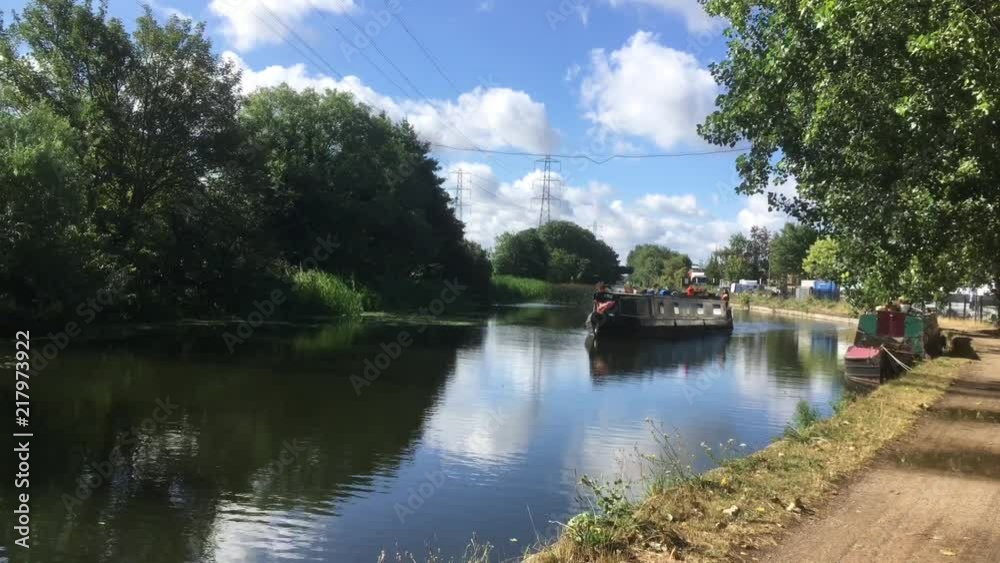 canal barge moving on the canal in europe canal barge moving on the canal in europe