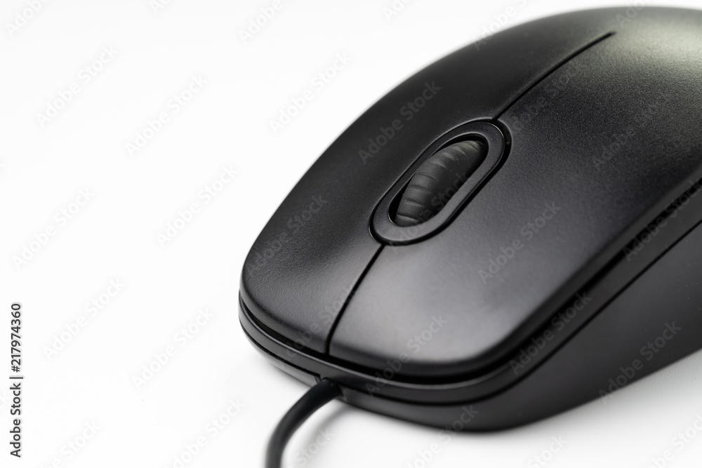 Close-up of black computer mouse with middle scroll wheel and cord on white background, website seo, internet or intention to click concept Close-up of black computer mouse with middle scroll wheel and cord on white background, website seo, internet or intention to click concept