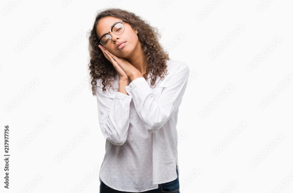 Beautiful young hispanic woman sleeping tired dreaming and posing with hands together while smiling with closed eyes. Beautiful young hispanic woman sleeping tired dreaming and posing with hands together while smiling with closed eyes.