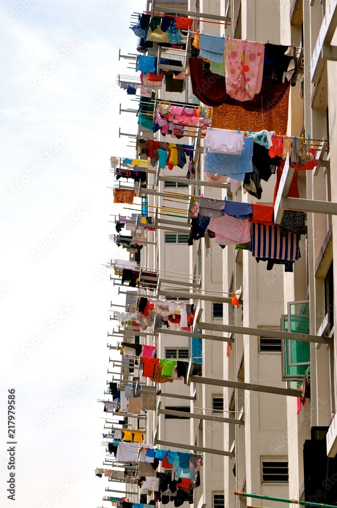 Stockfoto Laundry poles with clothes drying in the sun outside a