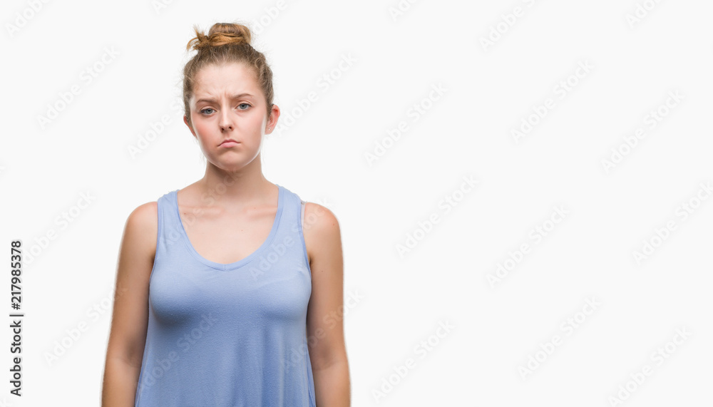 Young blonde woman depressed and worry for distress, crying angry and afraid. Sad expression. Young blonde woman depressed and worry for distress, crying angry and afraid. Sad expression.