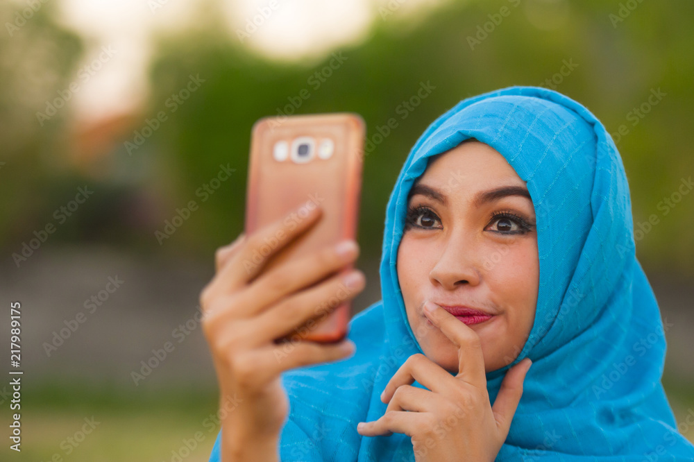 Premium Vector  Young muslim woman wearing hijab taking selfie