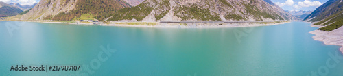 Drone aerial view of the Lake Livigno an alpine artificial lake. Italian Alps. Italy