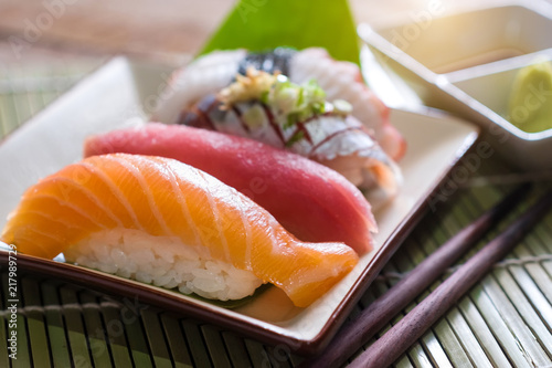 Sushi salmon & tuna sushi shrimp and wasabi on the white plate.selective focus