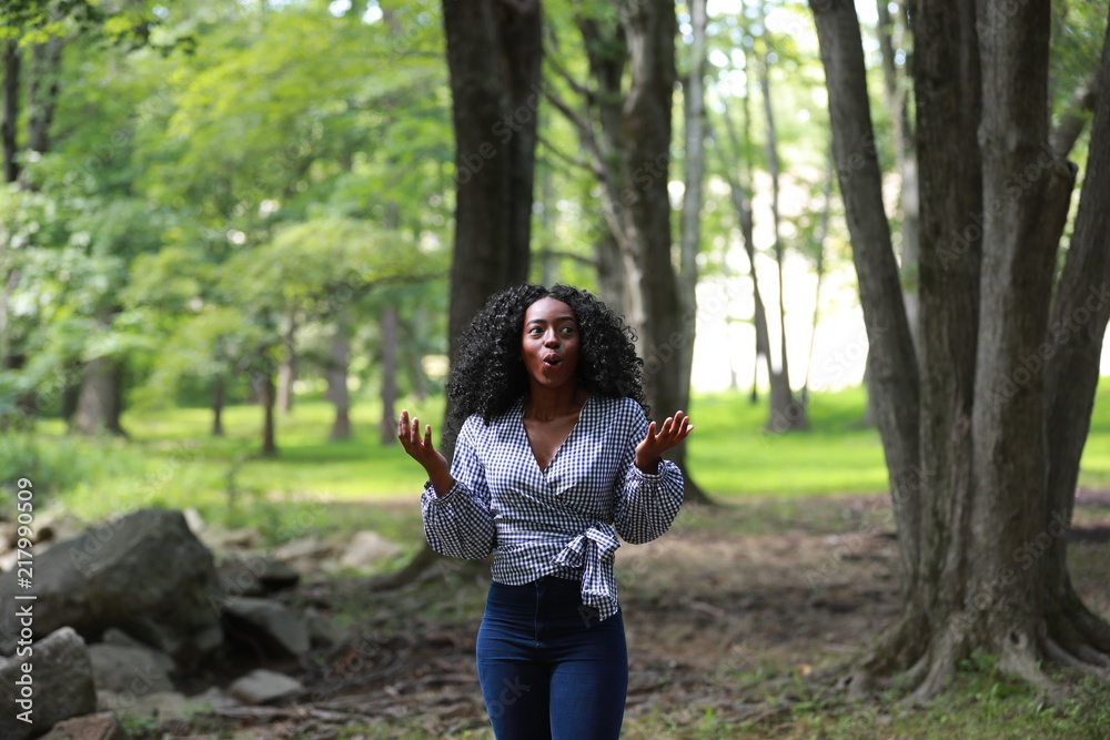 Pretty black woman looking around with shock Pretty black woman looking around with shock