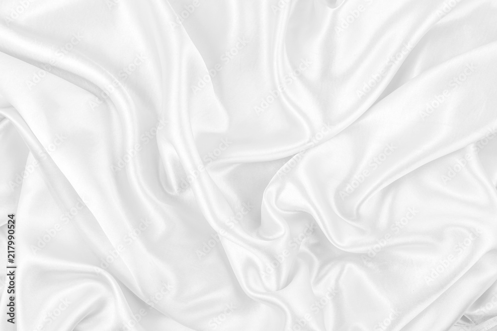 Luxurious of smooth white silk or satin fabric texture background
