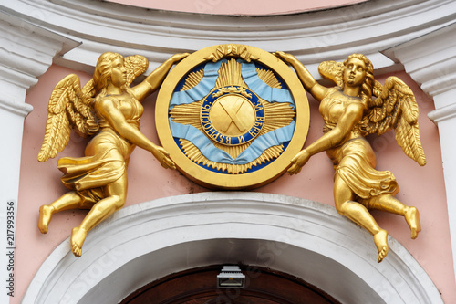 Angels holding insignia of Order of St. Andrew the First Called above entrance to Saint Andrew s Cathedral in Saint Petersburg  Russia