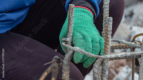 Laybor is tying steel for construction site photo