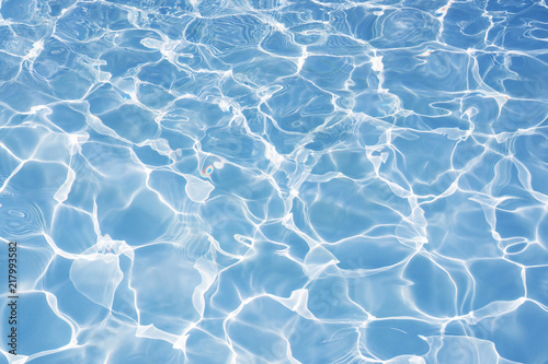 Blue water in swimming pool background