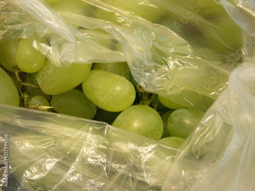 greeen grapes packed in a plastic foil photo