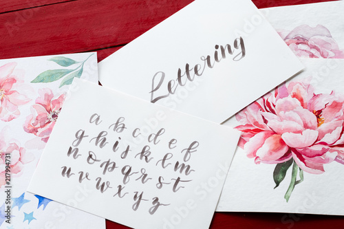 lettering art and calligraphy craft. handwritten italic cursive. drawn alphabet and watercolor floral paintings.