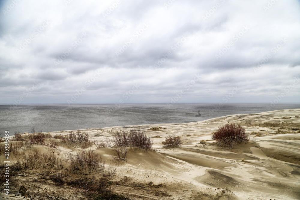 Beautiful view on sand dunes of the Curonian spit. Nida in Lithuania and Kaliningrad region in Russia Beautiful view on sand dunes of the Curonian spit. Nida in Lithuania and Kaliningrad region in Russia