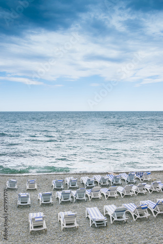 Empty beach chairs on the coast. © Konstiantyn Zapylaie