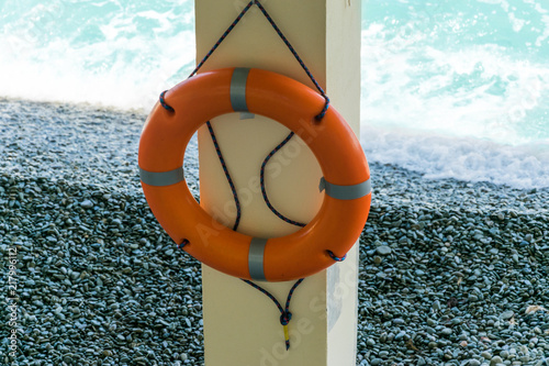 Lifebuoy on the background of the sea. Safety on the water, means of salvation. photo