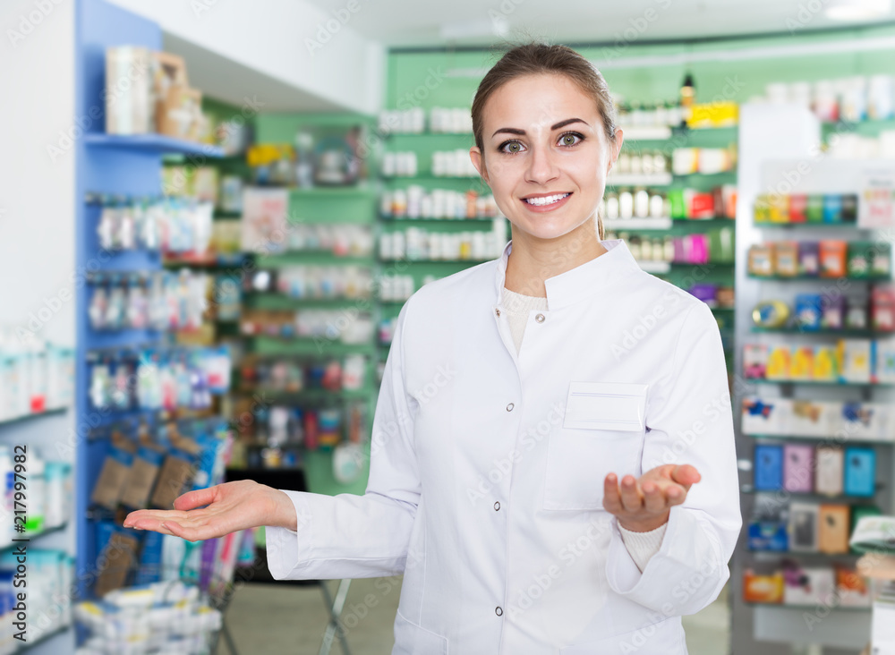 Female pharmacist standing in drugstore