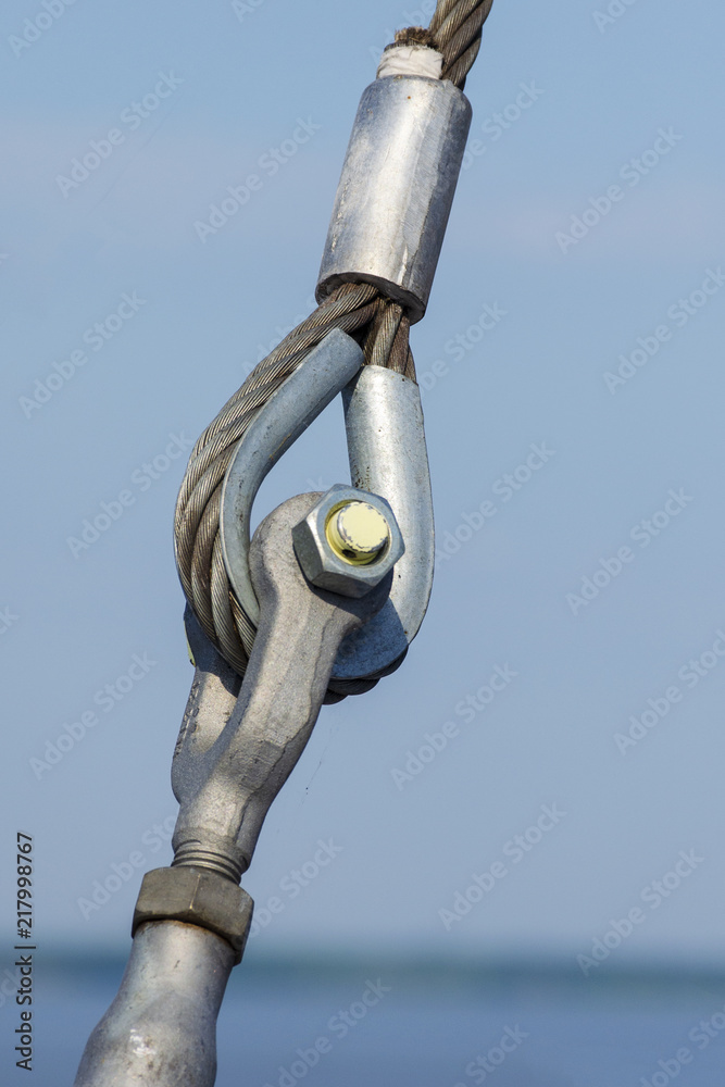 Loop connections of steel rope. Metal fastening element in ferry. Loop connections of steel rope. Metal fastening element in ferry.