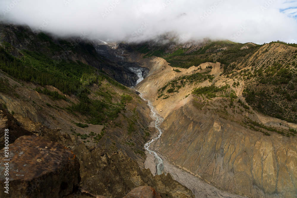 The water flowing off Gangapurna glacier creates a gorge in the moraine The water flowing off Gangapurna glacier creates a gorge in the moraine