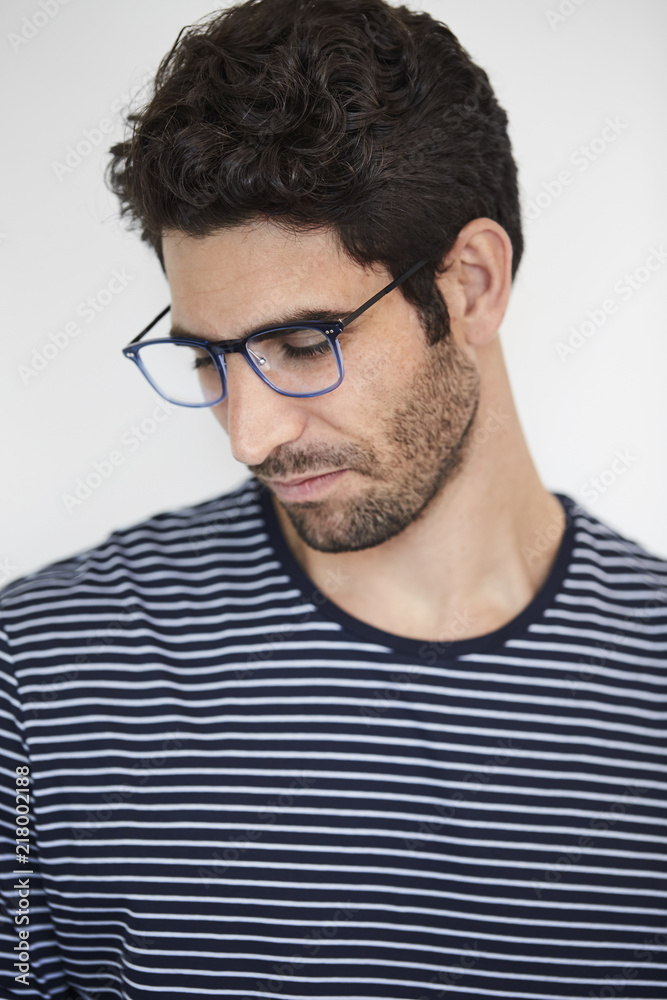 Dude looking down in spectacles, studio shot Dude looking down in spectacles, studio shot