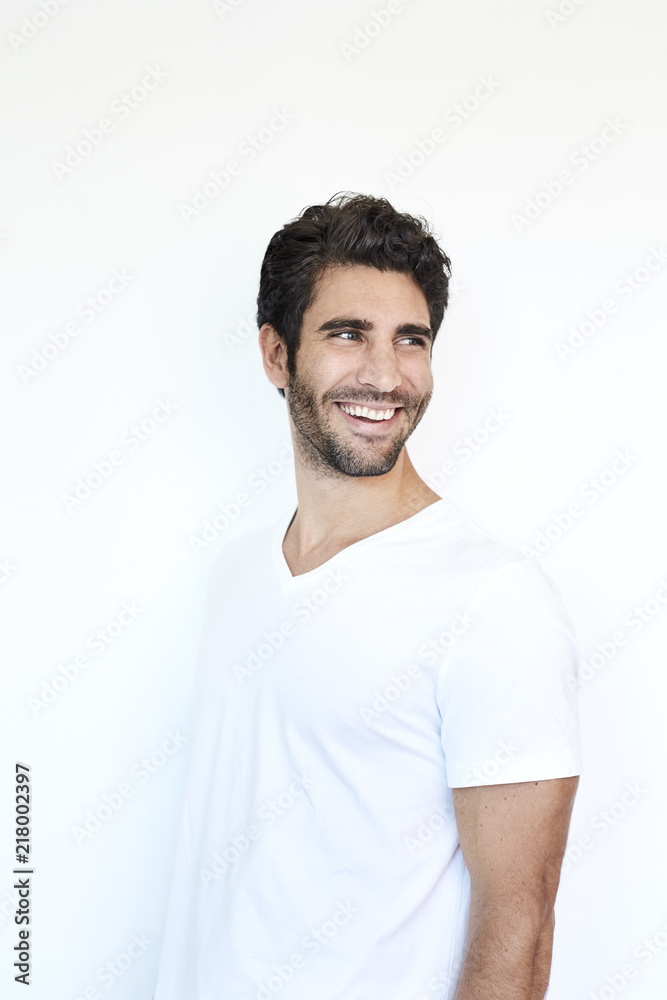 Dude in white smiling and looking over shoulder Dude in white smiling and looking over shoulder