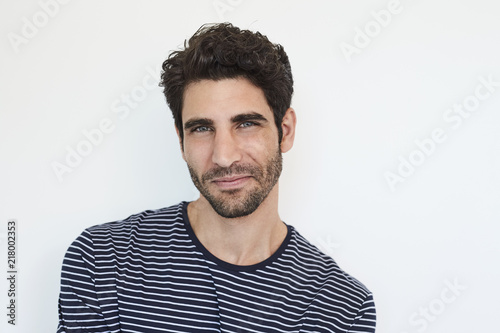 Blue eyed guy in striped top, portrait