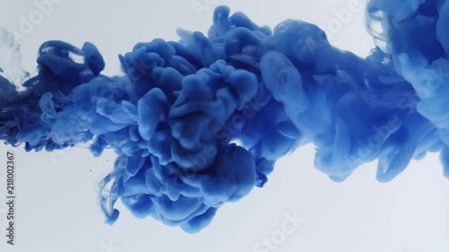 Blue ink in water and move in slow motion. photo