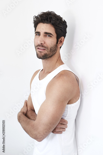 Portrait of handsome hunk in white vest